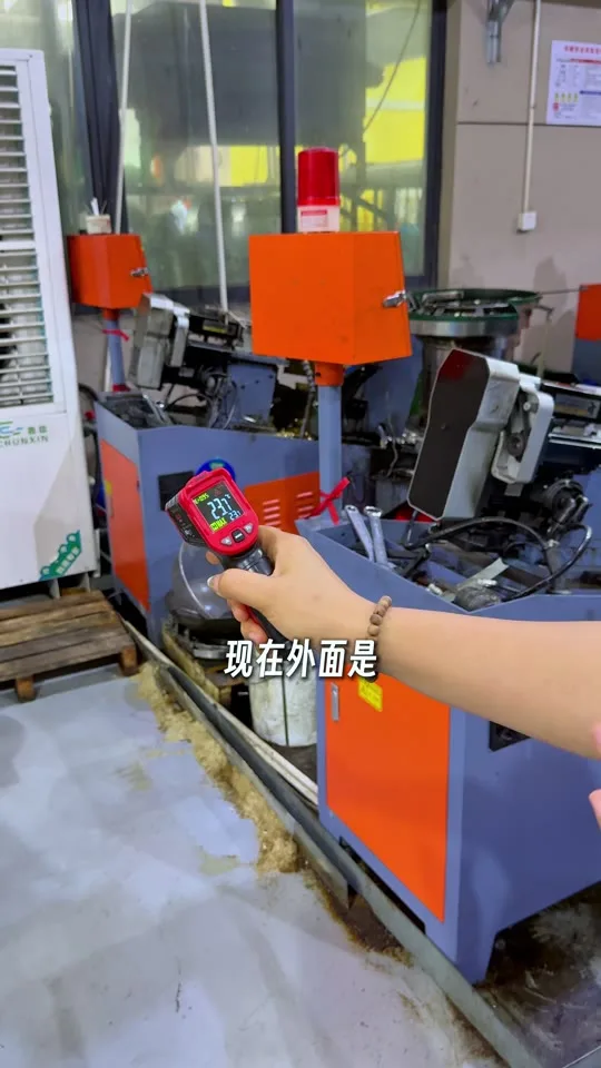 Production machine and handheld temperature meter in a Hongyuan workshop video still